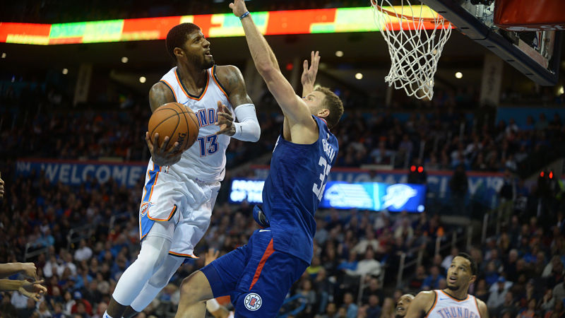 Oklahoma City Thunder forward Paul George and Detroit Pistons forward Blake Griffin