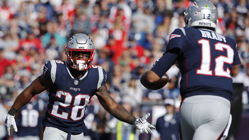 New England Patriots running back James White and quarterback Tom Brady