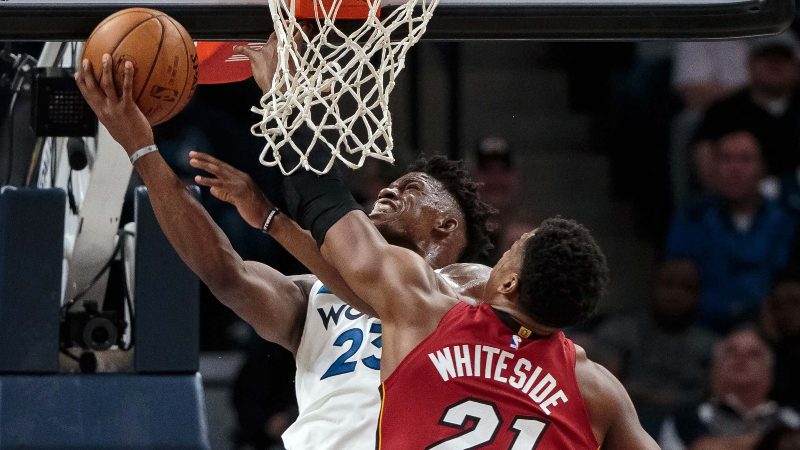 Miami Heat center Hassan Whiteside (21) and Minnesota Timberwolves forward Jimmy Butler (23)