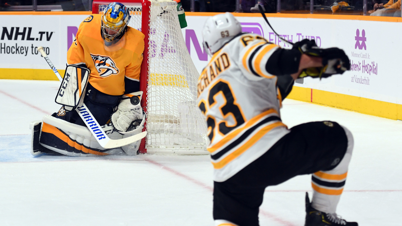 Boston Bruins Winger Brad Marchand And Nashville Predators Goalie Pekka Rinne