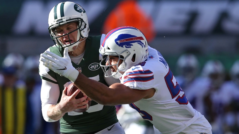 New York Jets Quarterback Josh McCown And Buffalo Bills Defensive End Jerry Hughes