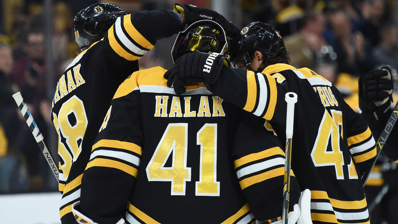 Boston Bruins players Torey Krug, Jaro Halak, David Pastrnak