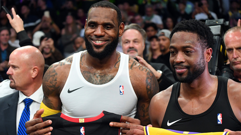 Los Angeles Lakers Forward LeBron James And Miami Heat Guard Dwayne Wade