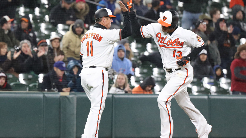Former Baltimore Orioles third baseman Manny Machado (13) celebrates with third base coach Bobby Dickerson