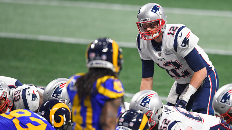 Los Angeles Rams defensive back Marqui Christian and New England Patriots quarterback Tom Brady