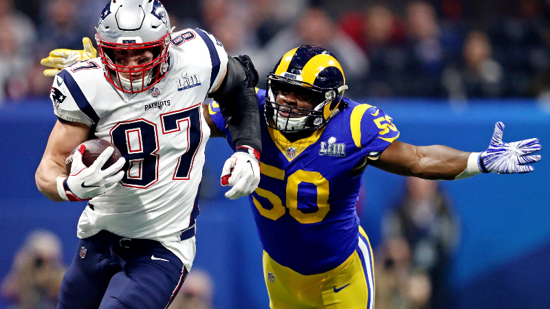 Ex-New England Patriots tight end Rob Gronkowski (87) and Los Angeles Rams outside linebacker Samson Ebukam (50)