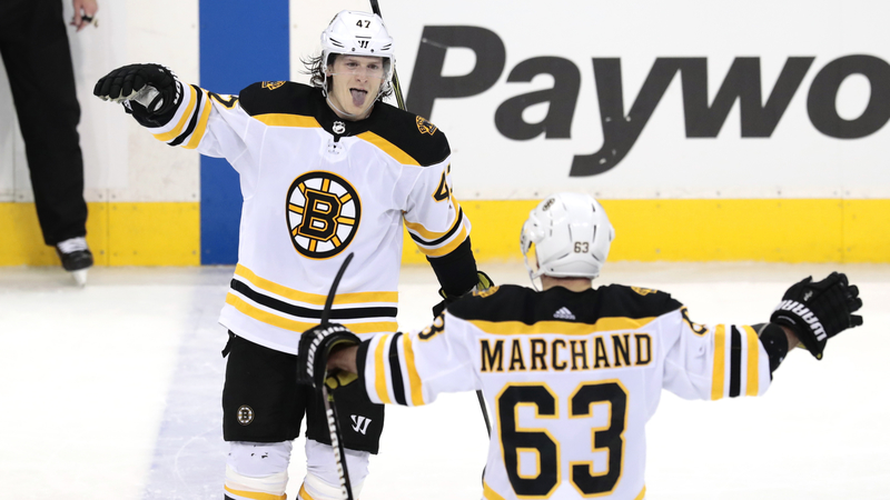 Boston Bruins' Torey Krug and Brad Marchand