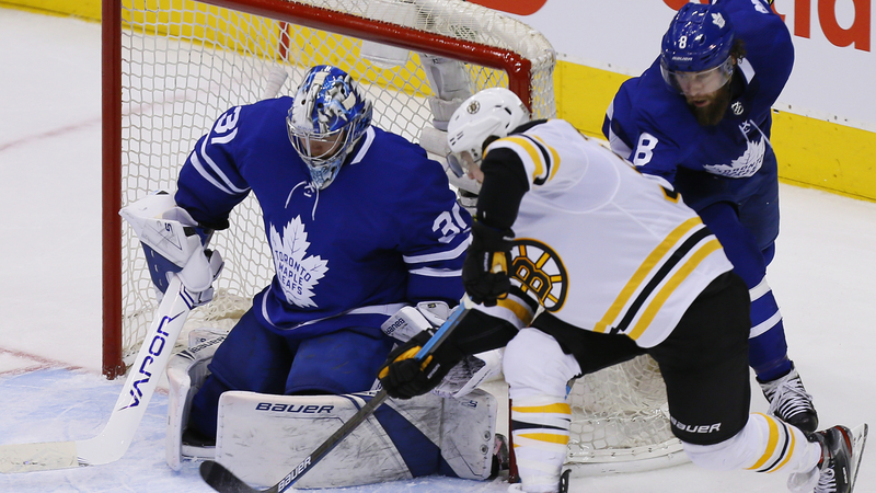 Toronto Maple Leafs Goaltender Frederik Andersen And Boston Bruins Winger David Pastrnak