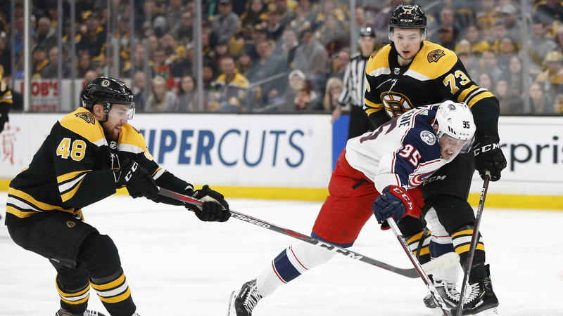 Boston Bruins Defensemen Matt Grzelcyk And Charlie McAvoy And Columbus Blue Jackets Center Matt Duchene