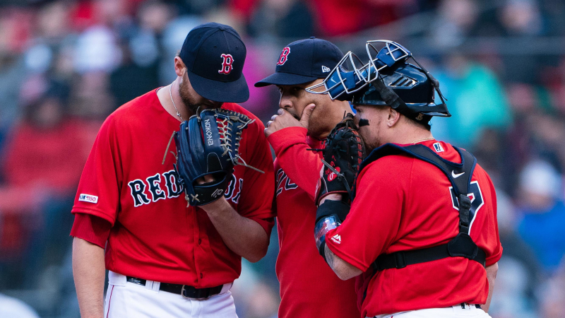 Boston Red Sox pitcher Colten Brewer, manager Alex Cora and catcher Christian Vazquez