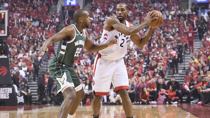 Milwaukee Bucks forward Khris Middleton and Toronto Raptors forward Kawhi Leonard