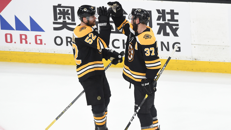 Boston Bruins Center's Sean Kuraly And Patrice Bergeron