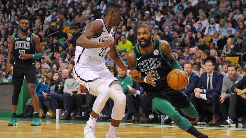 Brooklyn Nets guards Caris LeVert and Kyrie Irving