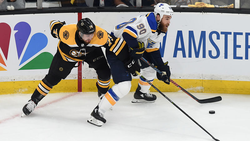 Boston Bruins wing Jake DeBrusk and St. Louis Blues center Ryan O'Reilly