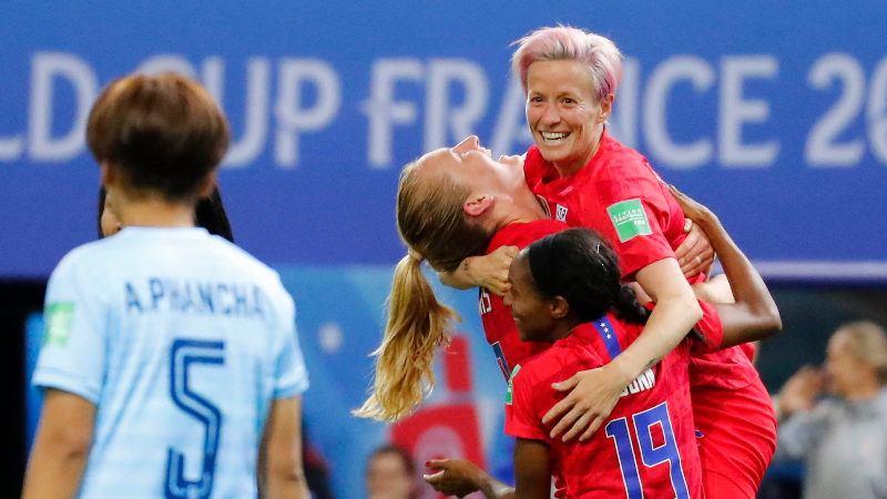 United States midfielder Sam Mewis (3), defender Crystal Dunn (19) and forward Megan Rapinoe (15)