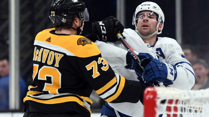 Boston Bruins defenseman Charlie McAvoy (73) and Toronto Maple Leafs center John Tavares (91)