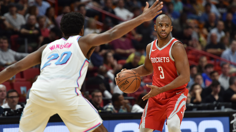 Houston Rockets guard Chris Paul (3) and Miami Heat forward Justice Winslow