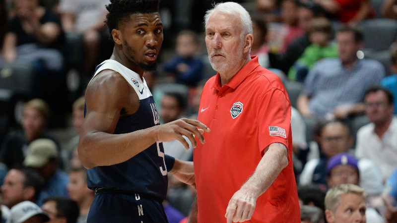 USA head coach Gregg Popovich and guard Donovan Mitchell