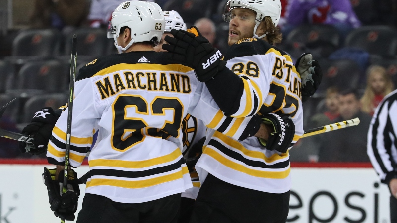 Boston Bruins right wing David Pastrnak (88) and left wing Brad Marchand (63)