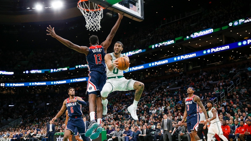 Boston Celtics forward Jayson Tatum (0) and Washington Wizards center Thomas Bryant (13)