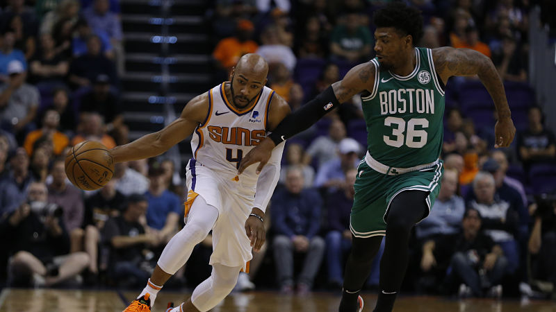 Phoenix Suns guard Jevon Carter and Boston Celtics guard Marcus Smart