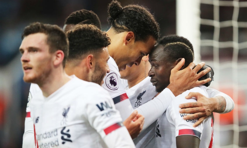 Liverpool forward Sadio Mane (left) and defender Virgil Van Dijk (center)