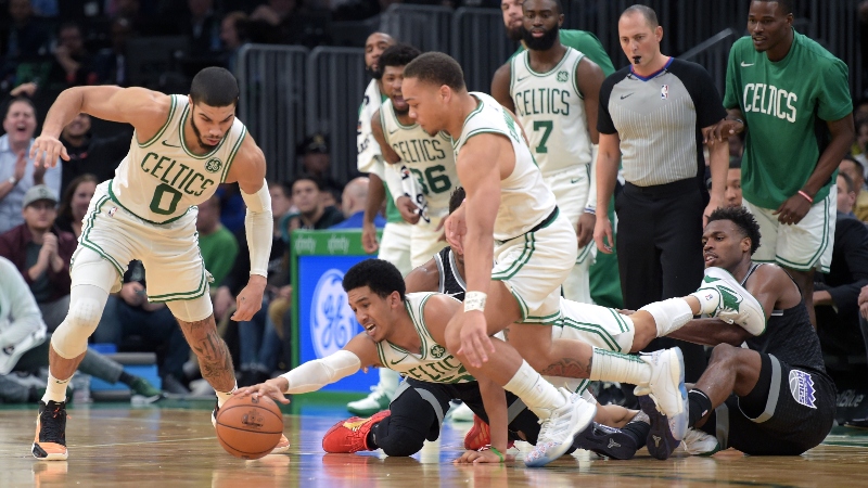 Boston Celtics guards Tremont Waters (center), Carsen Edwards (right) and forward Jayson Tatum (left)