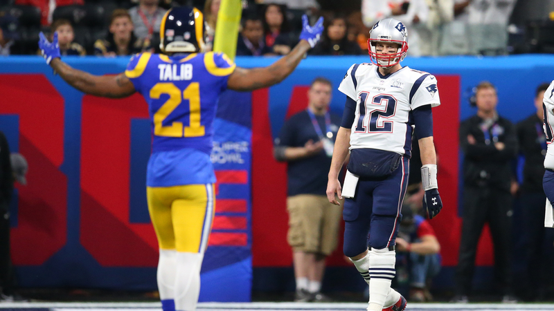 Miami Dolphins Cornerback Aqib Talib And New England Patriots Quarterback Tom Brady