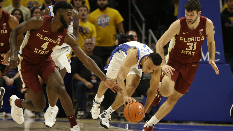 Pittsburgh Panthers guard Trey McGowens (middle) and Florida State Seminoles forwards Patrick Williams (4) and Wyatt Wilkes (31)