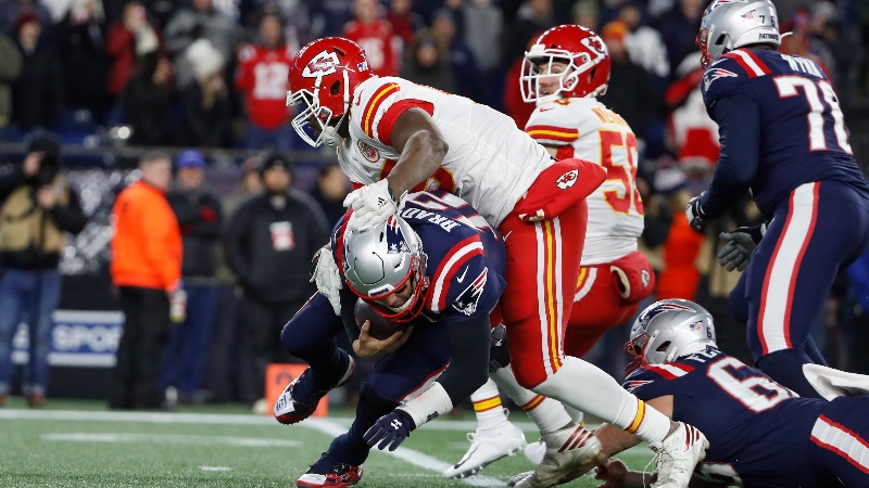 Kansas City Chiefs defensive end Chris Jones (95) and New England Patriots quarterback Tom Brady