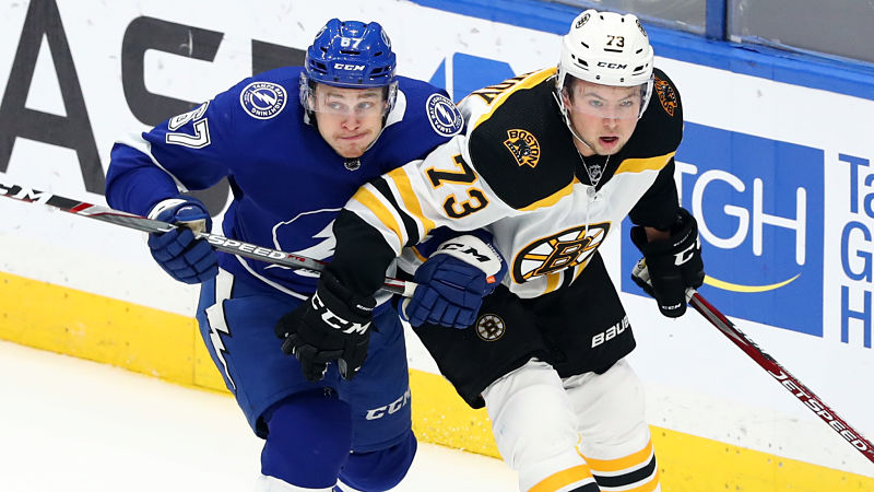 ampa Bay Lightning center Mitchell Stephens and Boston Bruins defenseman Charlie McAvoy