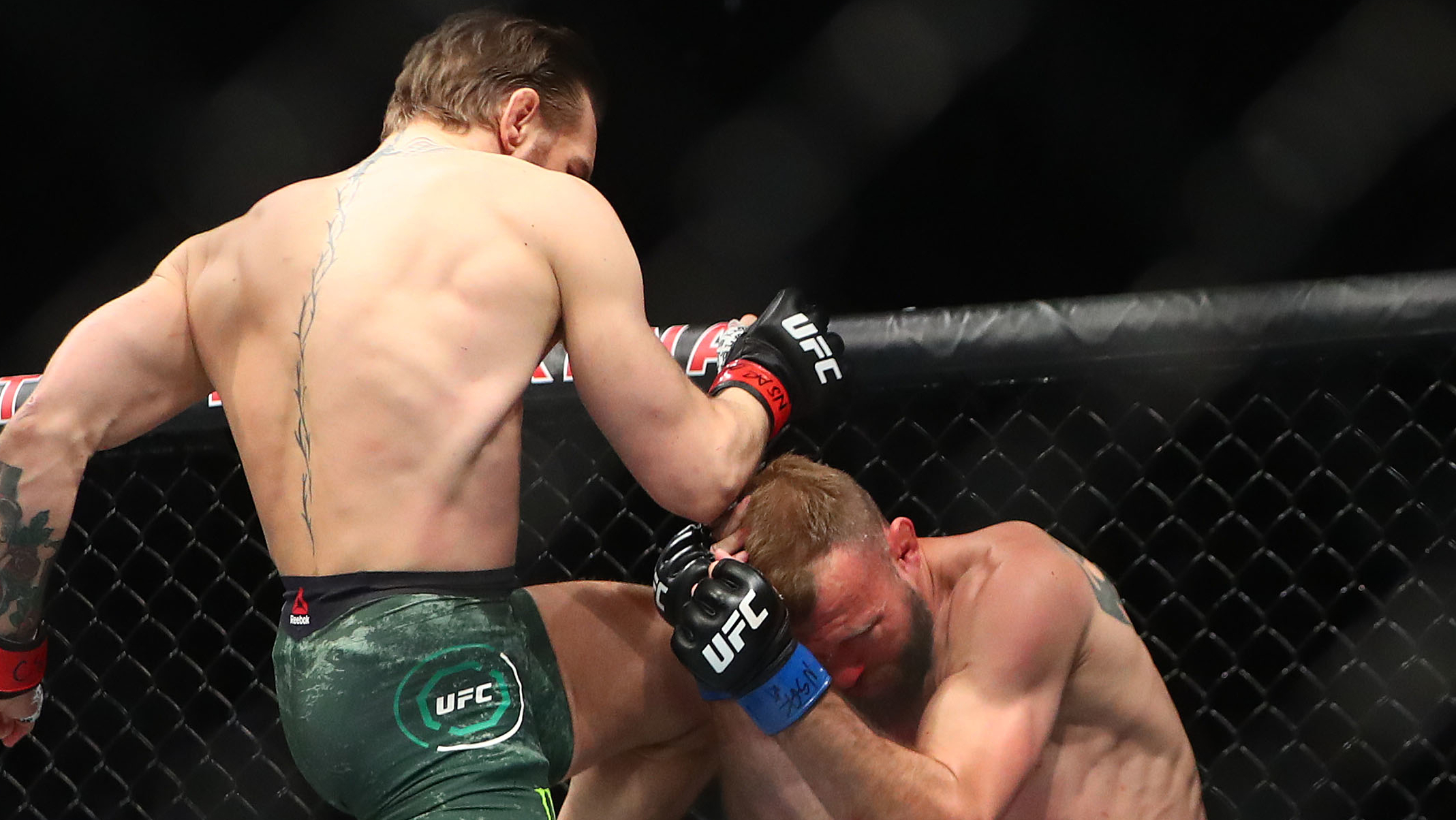 Conor McGregor with a knee to the head