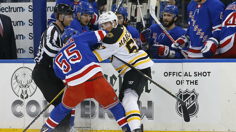 Boston Bruins Winger Brad Marchand And New York Rangers Defenseman Ryan Lindgren