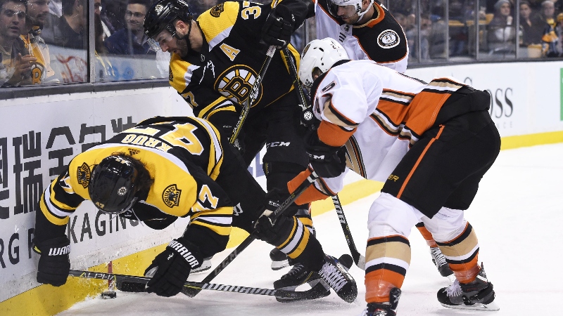 Boston Bruins defenseman Torey Krug (left), center Patrice Bergeron (middle) and forward Ondrej Kase