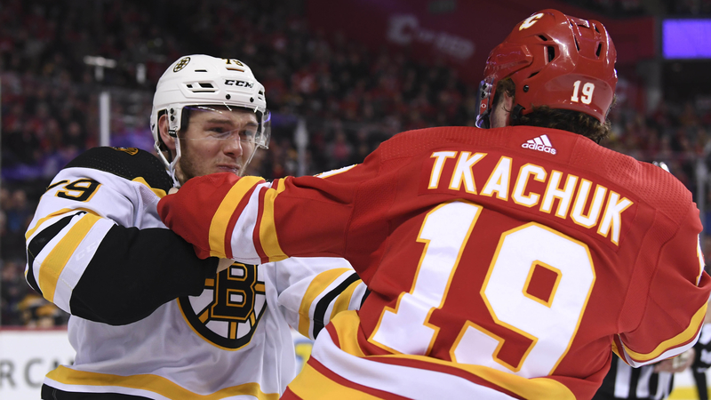 Bruins defenseman Jeremy Lauzon, Flames winger Matthew Tkachuk