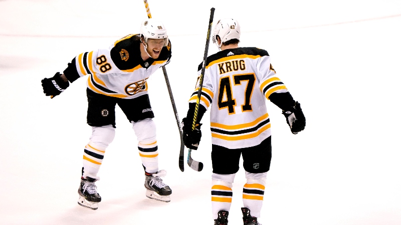 oston Bruins right wing David Pastrnak (left) and defenseman Torey Krug