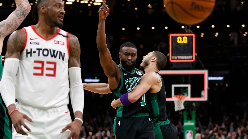 Boston Celtics forwards Jaylen Brown (center) and Jayson Tatum (right)