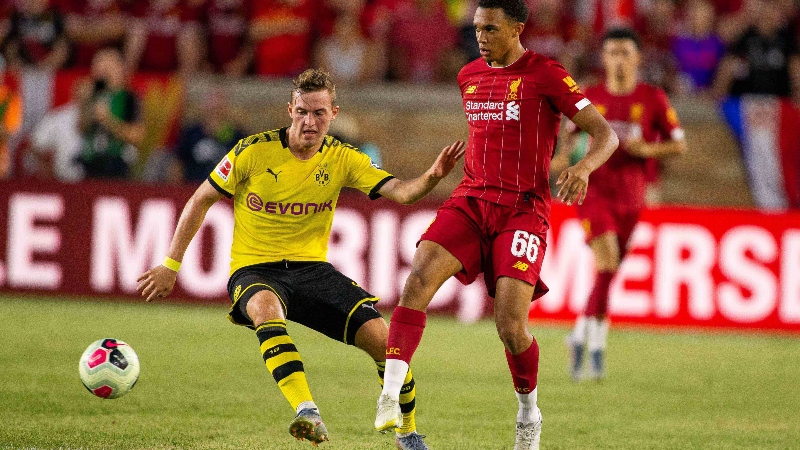 Liverpool defender Trent Alexander-Arnold (66) and Borussia Dortmund forward Jacob Bruun Larsen (34)