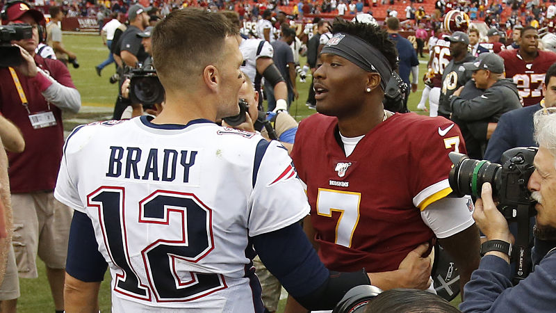 Former New England Patriots quarterback Tom Brady greets Washington Redskins quarterback Dwayne Haskins