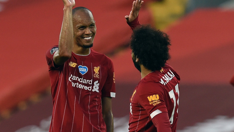 Liverpool midfielder Fabinho (left) and forward Mohamed Salah