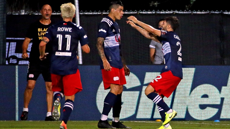New England Revolution forward Gustavo Bou (7) and midfielders Carles Gil (22) and Keylyn Rowe (11)