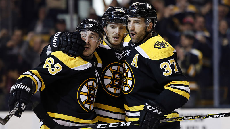 Boston Bruins winger Brad Marchand, defenseman Kevan Miller and center Patrice Bergeron