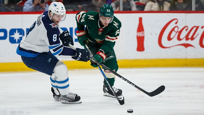 Winnipeg Jets defenseman Jacob Trouba and Minnesota Wild forward Tyler Ennis