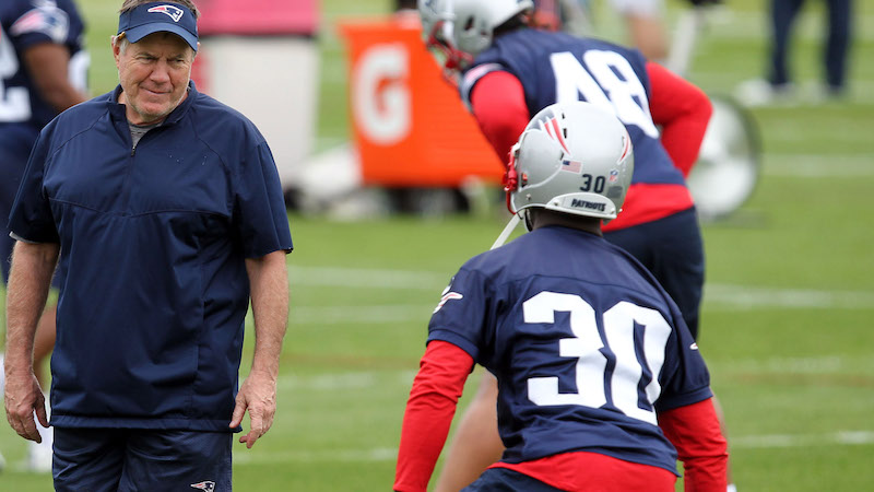 Patriots head coach Bill Belichick, cornerback Jason McCourty