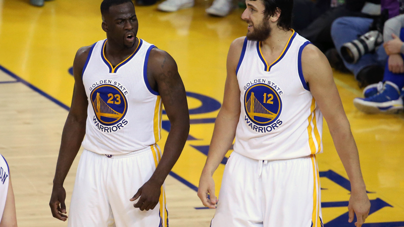Golden State Warriors forward Draymond Green (23) and former center Andrew Bogut (12)