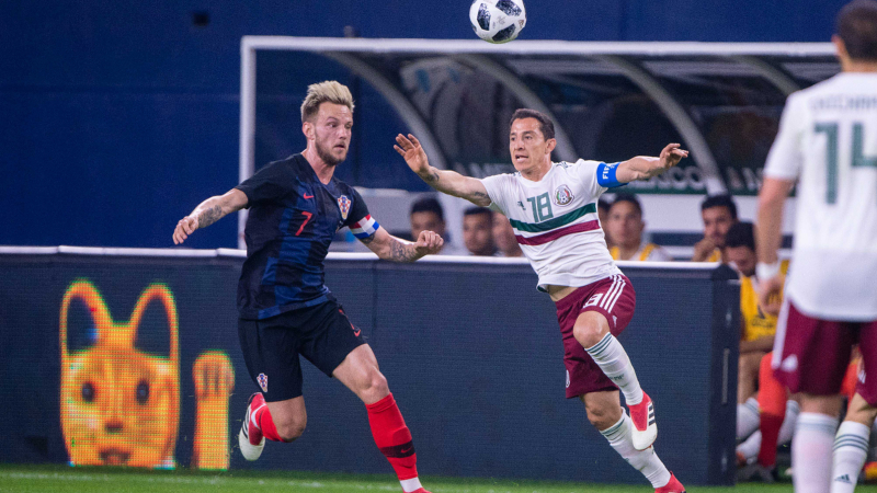 Croatia midfielder Ivan Rakitic (7) and Mexico defender Andres Guardado (18)