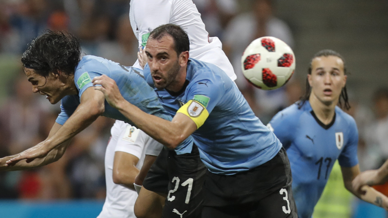 Uruguay players Edinson Cavani (left) and Diego Godin