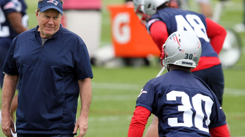 Patriots head coach Bill Belichick, cornerback Jason McCourty