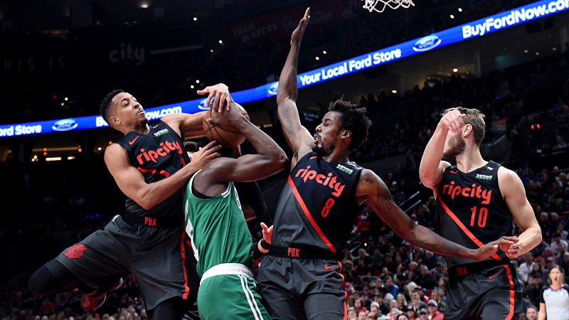 Boston Celtics guard Jaylen Brown and Portland Trail Blazers guard CJ McCollum
