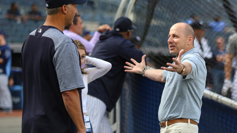 ormer New York Yankees pitcher Andy Pettitte (l) and general manager and senior vice president Brian Cashman (r)